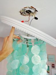 Covering Cracks Around A Light Fixture With A Ceiling Medallion