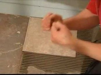 Laying The First Floor Tile