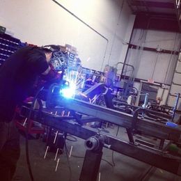 Phil welding up a custom chassis for a customer’s...