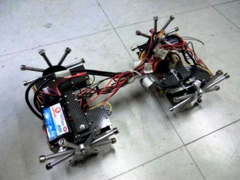 Crablike robot walks on walls, ceilings with magnet feet