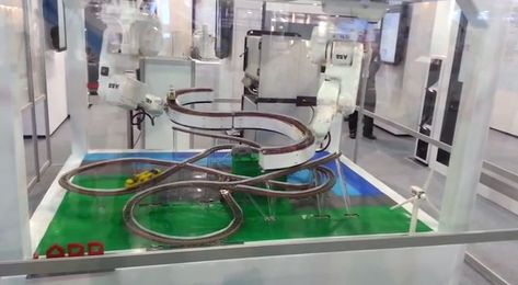 Watch These Robots Play With Trains