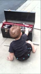 Funny. +Humour. Smile. Baby helps change a flat tire on mommy's car. IMG 13381]