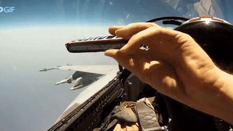 How fighter jet pilots pass snack bars in the cockpit while flying