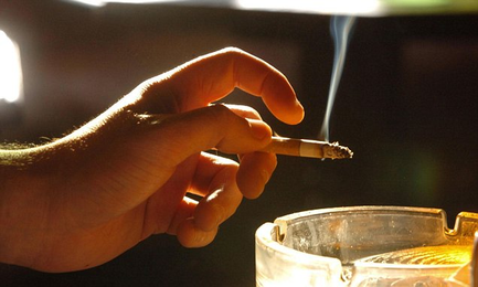 How PASSIVE smoking can make you lose your teeth