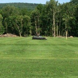 Every driving range should have an old car as a target