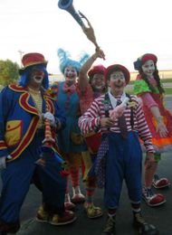 Go to clown school to learn how to become a clown