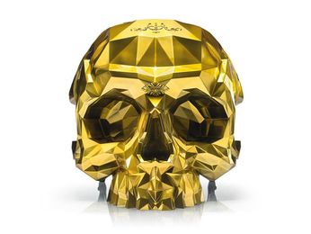 Calling all supervillains. Here's your 24-karat gold skull armchair