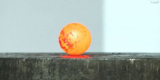 Watch a Red Hot Nickel Ball Go Up Against a Hydraulic Press