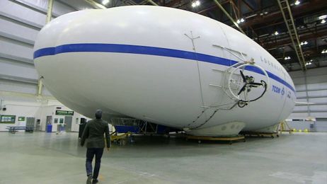 Robotic "spiders" repair holes in hybrid airships.