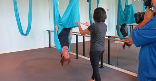 The upside of downward-facing dog: Aerial yoga lifts fitness, profits
