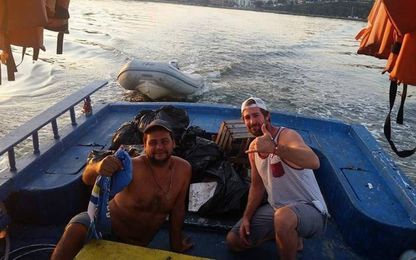Where condoms, corpses and cans clog Rio water, a sailor cleans up 