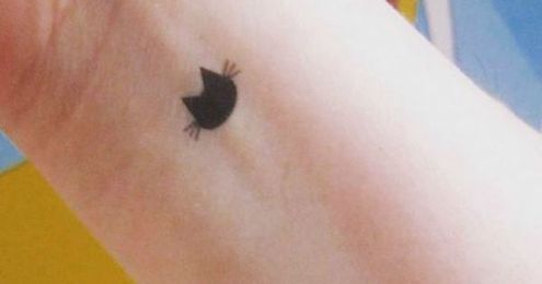 56 Cat Tattoos That Will Make You Want to Get Inked: Tiny cat head tattoo