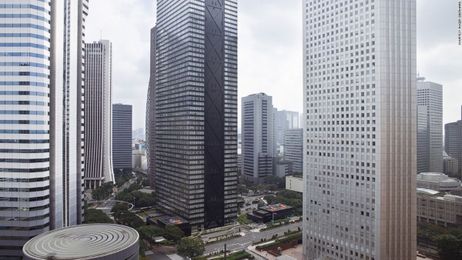 Can you guess the city from the hotel window?