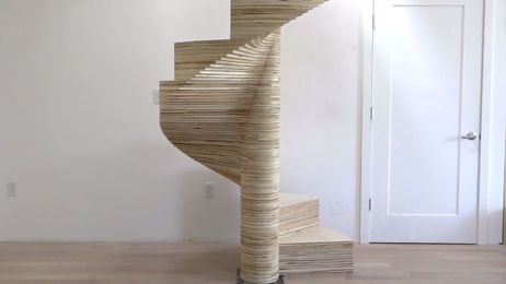 A spiral staircase made out of plywood