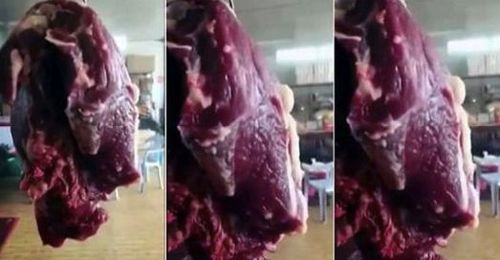 Slab Of Meat Is Still Twitching As It's Hung In A Shop