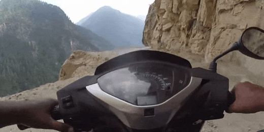 Driving a Moped on a Narrow Mountain Pass Is the Worst Commute