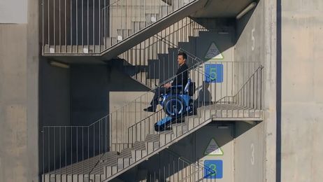 This wheelchair can climb up and down stairs