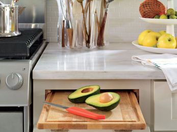 The Real Reason Old Kitchens Have Pull-Out Cutting Boards Will Surprise You