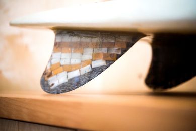 What can you make with 10,000 cigarette butts? Apparently, a usable surfboard