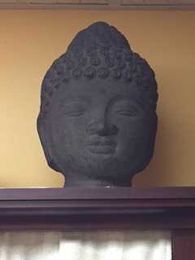 Why I Have a Buddha Head in My Massage Room