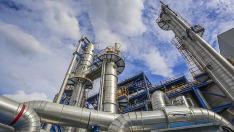 How can a compressor help reduce in-plant emissions?