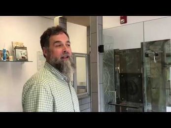 How to fix a popping of clicking sound coming from a frameless door hinge.