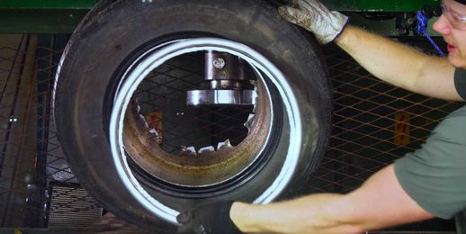 Watch This Wheel Explode Into a Dozen Pieces as It's Crushed From Its Center