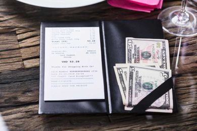 The exact percentage you should actually tip when dining out in America