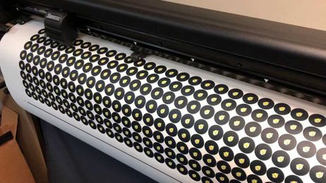 Making custom branded pool table dots.