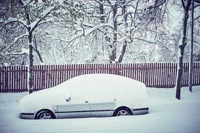 Dad Uses Own Child as Snow Scraper That Gets the Job Done