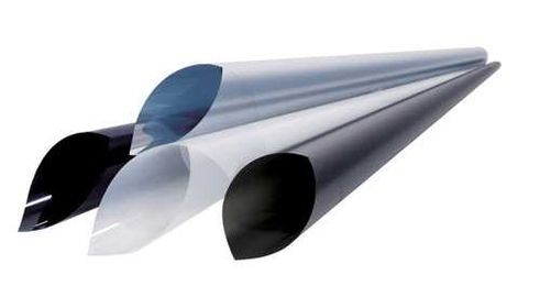 Can you apply window film over stickers on a glass pane?