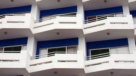 Who should pay for repair of building's balconies?