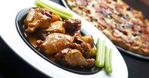 The Reason So Many Pizza Chains Sell Chicken Wings