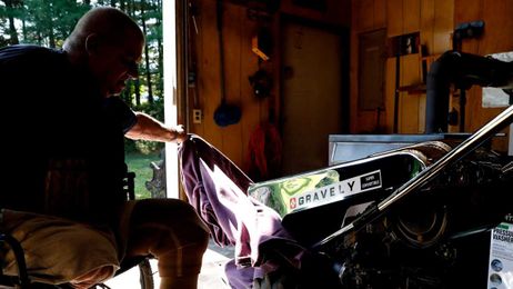 Man collects and repairs Gravely Tractors despite loss of legs