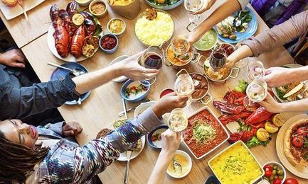 People eat up to 50 per cent more when they're with friends or family