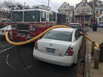 What firefighters did when a vehicle blocked a fire hydrant