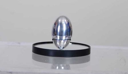 Demonstrating  a cool spinning ellipsoid called a phi top