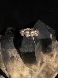OLD SKULL RING  Size 7 1/2  Nine Tiny Human Skulls Age