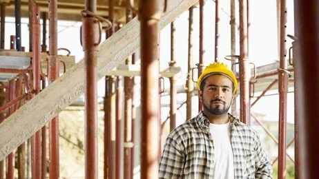 How many hours a construction worker needs to work to afford a home in their city