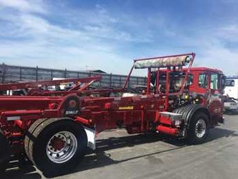 Steel or Aluminum Arms for Your Roll-Off Tarping System?