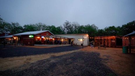 Feed store-turned-turned rustic chic patio bar is your next favorite hangout