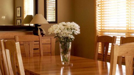 Vase Of Flowers On Kitchen Table Probably Memorial For Person Who Died There
