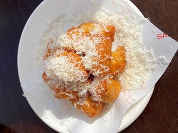 Cheese puffs are everywhere on restaurant menus. We look into why