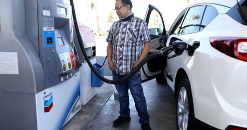 How to spend less on gas: Fix your car. Drive slower. Ignore Shaq